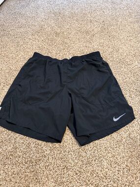 Nike Men’s Black Athletic Shorts with Silver Swoosh Accent